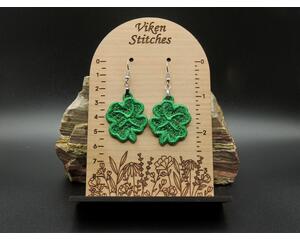 Machine embroidered green four leaf clover earrings with raised edges. Silver hypoallergenic hooks.
